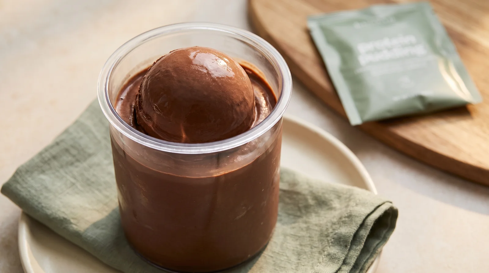 Smooth scoop of chocolate protein ice cream made in a Ninja Creami
