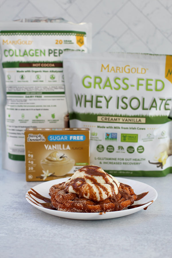 Churro sundae in front of MariGold whey and collagen with Simply Desserts vanilla pudding box