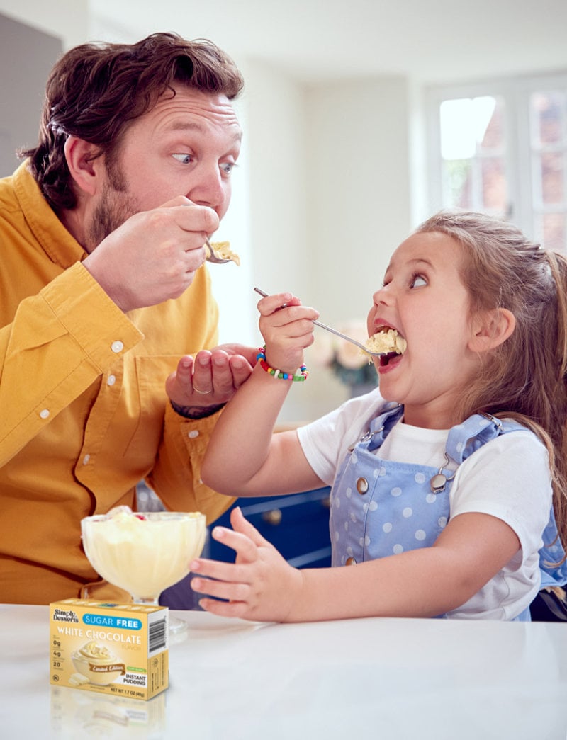 Dad and Daughter eating White Chocolate Pudding by Simply Desserts