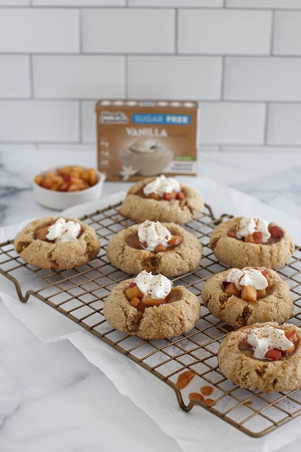Simply Desserts Vanilla Pudding box with freshly baked apple pie cookies on a wire rack front view