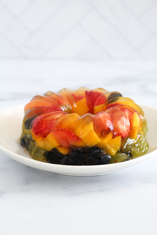 Side angle of the Fruity Jel Cake showing glossy layers of colorful fruit
