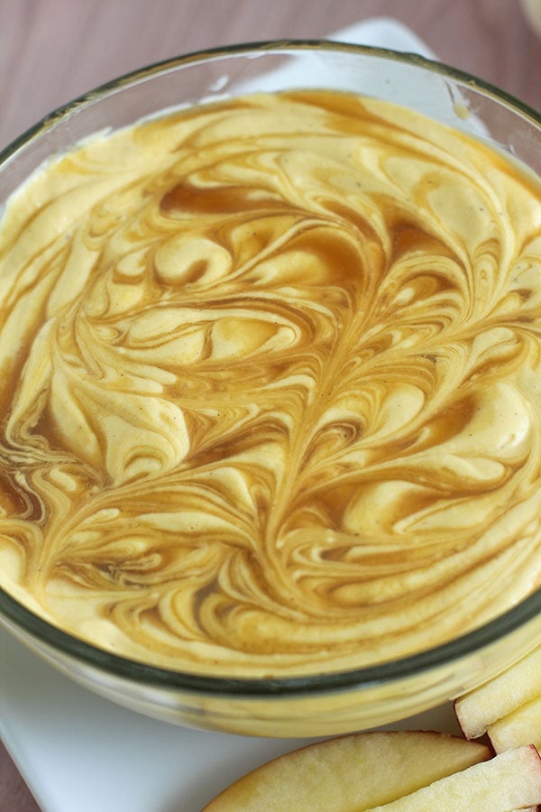Close-up of creamy pumpkin spice cheesecake dip made with Simply Desserts Vanilla Pudding, swirled with sugar-free caramel sauce