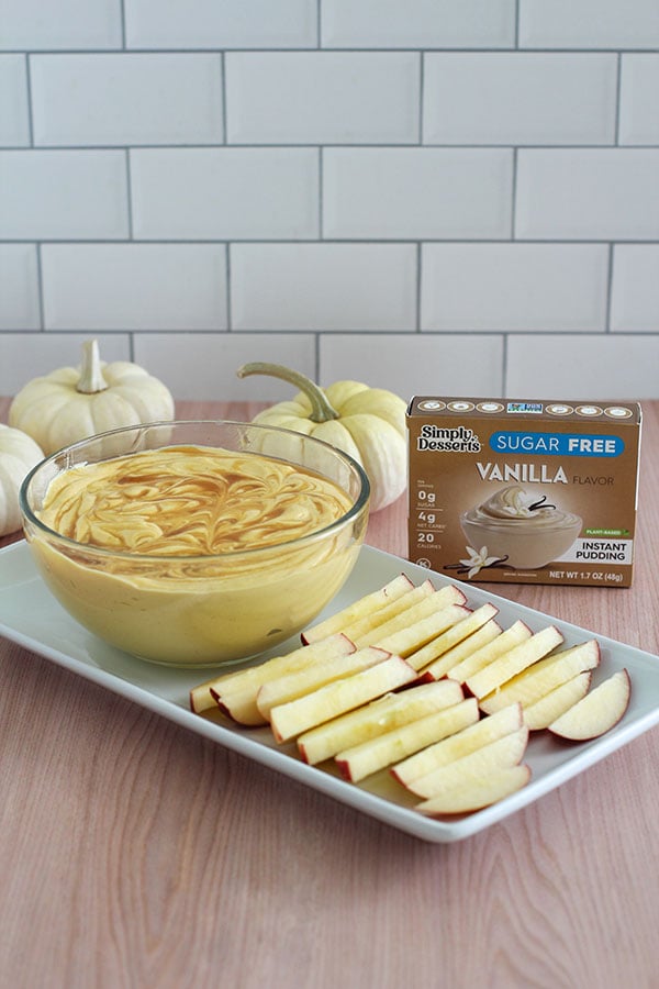 Pumpkin spice cheesecake dip made with Simply Desserts Sugar-Free Vanilla Pudding mix, served with apple slices
