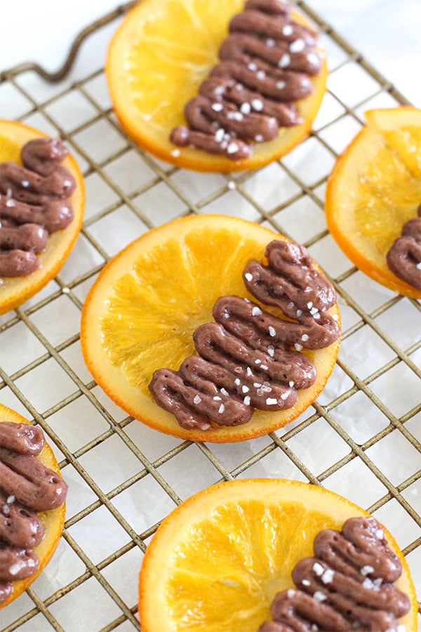 Candied orange slices with Simply Desserts sugar free chocolate pudding on a cooling rack