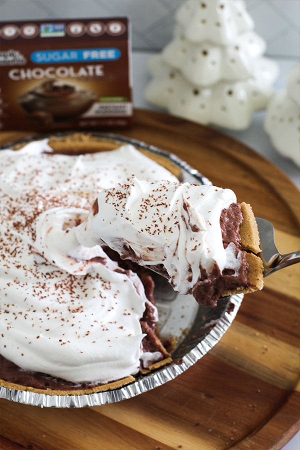 Slice of sugar-free chocolate silk pie with whipped topping made using Simply Desserts chocolate